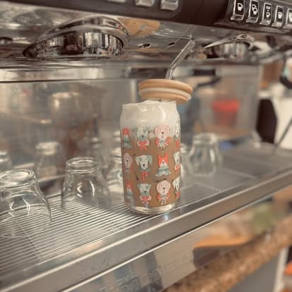 The espresso machine with patterned glass cups on the counter